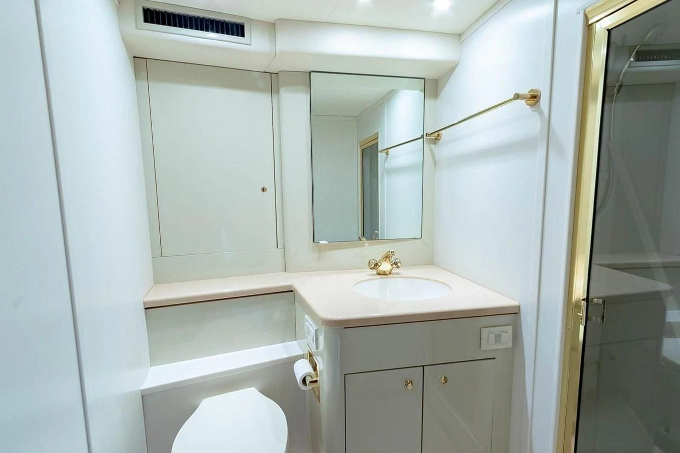 a bathroom with a sink and a mirror aboard PURELY PLEASURE Yacht for Sale
