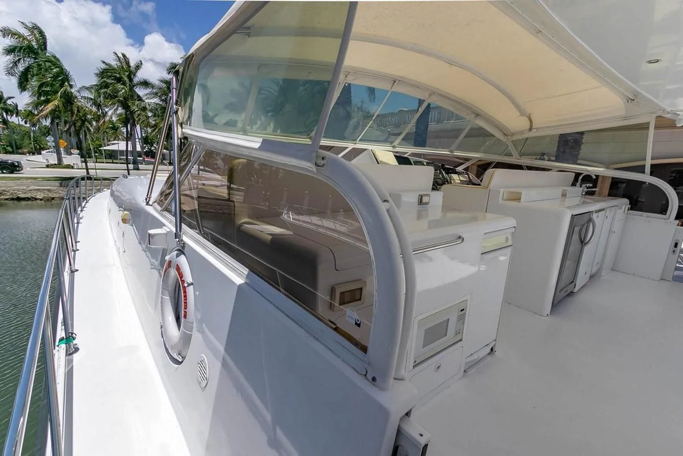 a boat with a large white canopy aboard PURELY PLEASURE Yacht for Sale