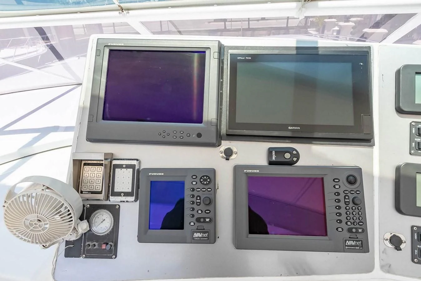 a couple of electronic devices aboard PURELY PLEASURE Yacht for Sale