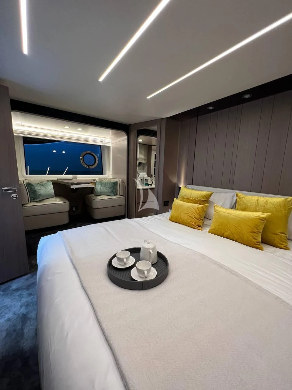 a bed with a white bed spread aboard SOLSTICE Yacht for Sale