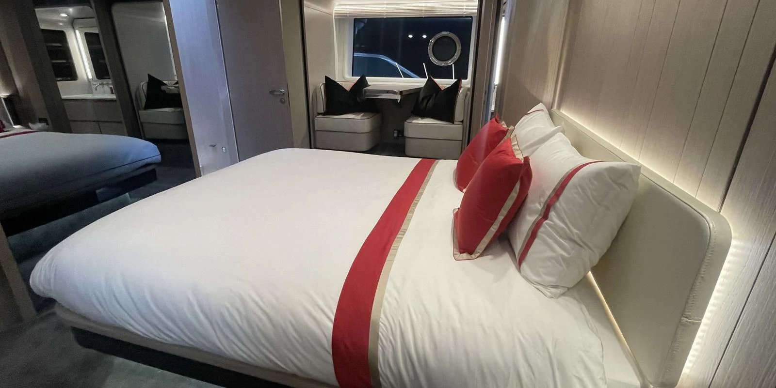 a bed with white sheets aboard SOLSTICE Yacht for Sale