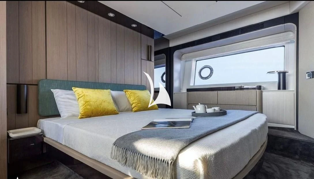 a bed with a white sheet aboard SOLSTICE Yacht for Sale