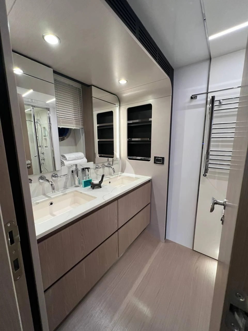 a bathroom with a sink and a mirror aboard SOLSTICE Yacht for Sale