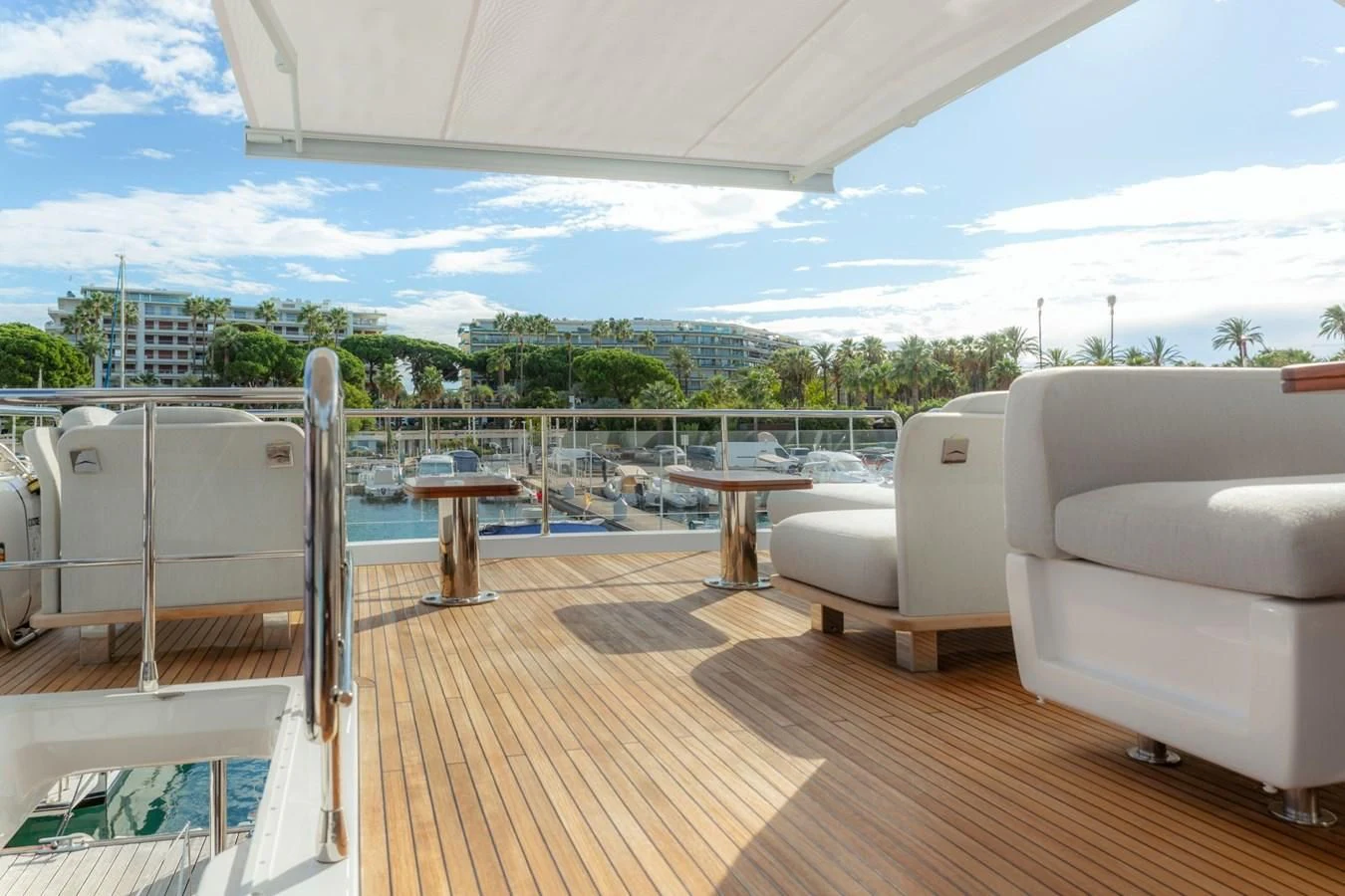 a deck with a view of a city and water aboard SOLSTICE Yacht for Sale