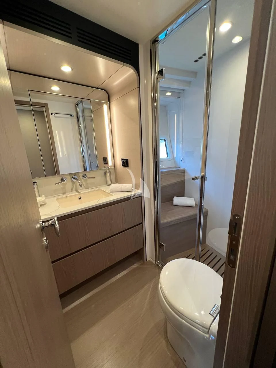 a bathroom with a large mirror aboard SOLSTICE Yacht for Sale