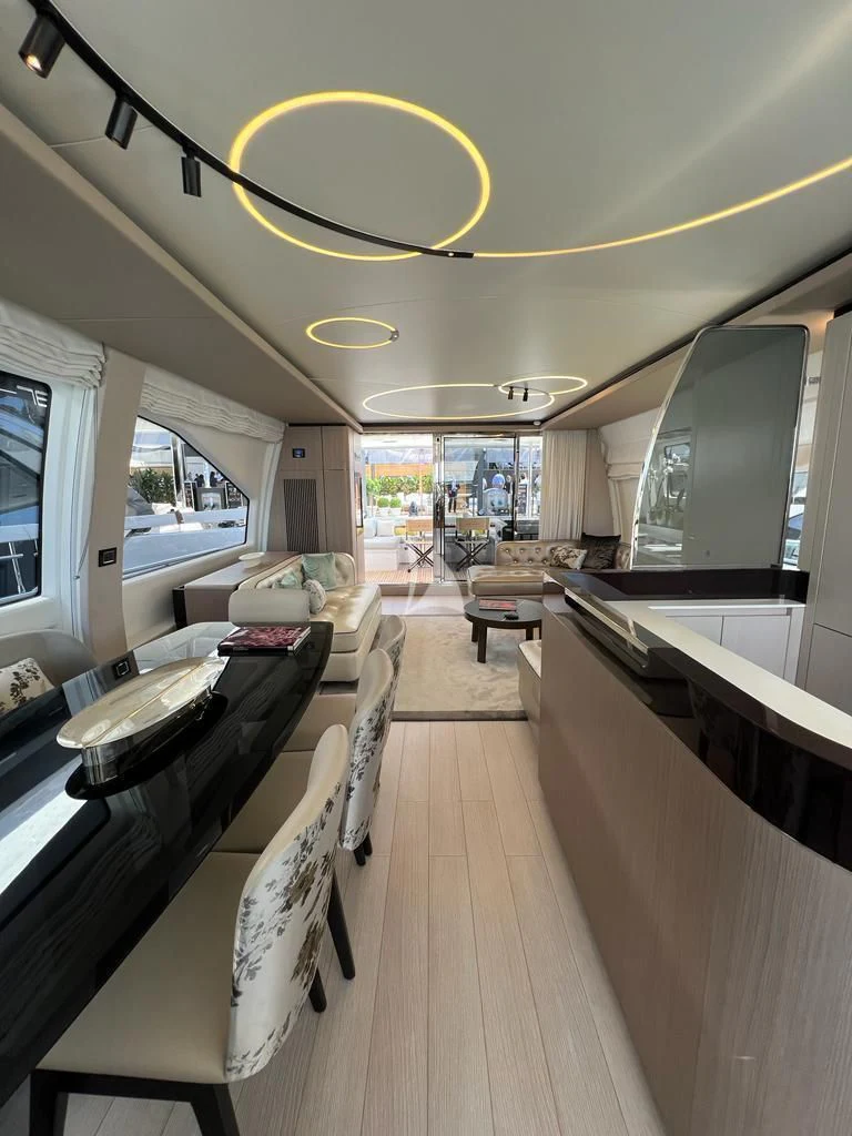 a large room with a wood floor aboard SOLSTICE Yacht for Sale