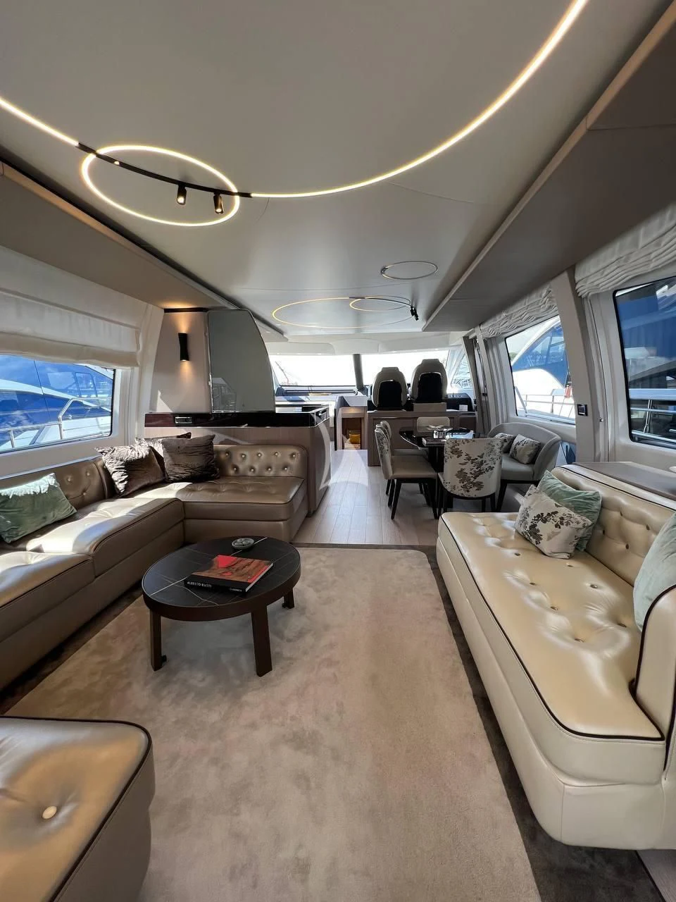 a living room with a couch and a coffee table aboard SOLSTICE Yacht for Sale