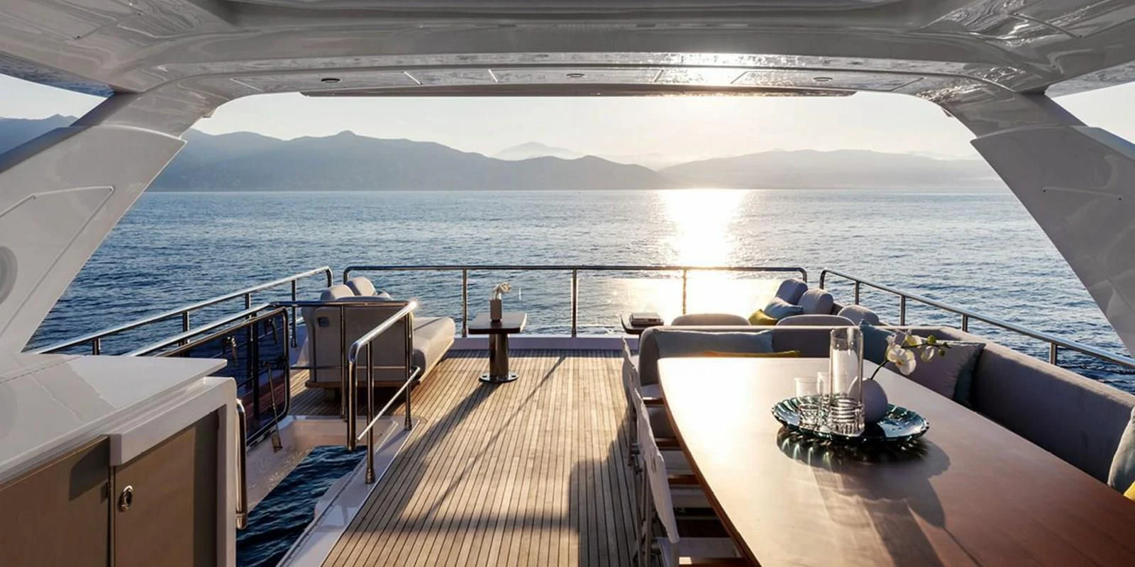 a deck with a large body of water and a large ship aboard SOLSTICE Yacht for Sale
