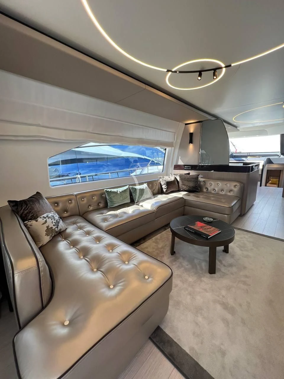 a living room with a large window aboard SOLSTICE Yacht for Sale