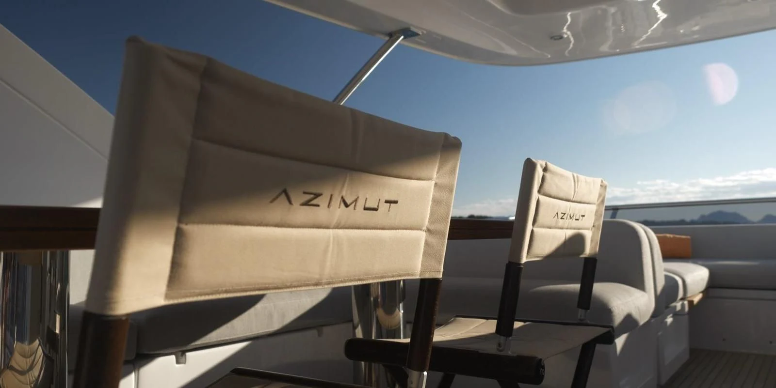 a chair with a book on it aboard SOLSTICE Yacht for Sale