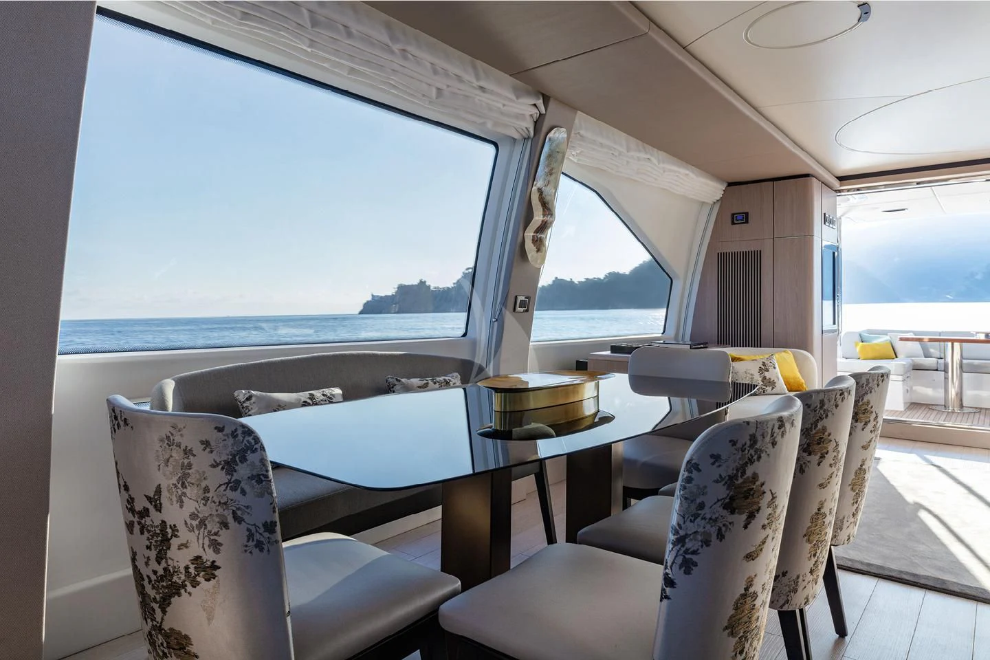 a room with a table and chairs aboard SOLSTICE Yacht for Sale