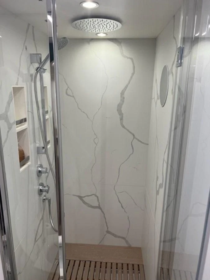 a shower with a glass door aboard SOLSTICE Yacht for Sale