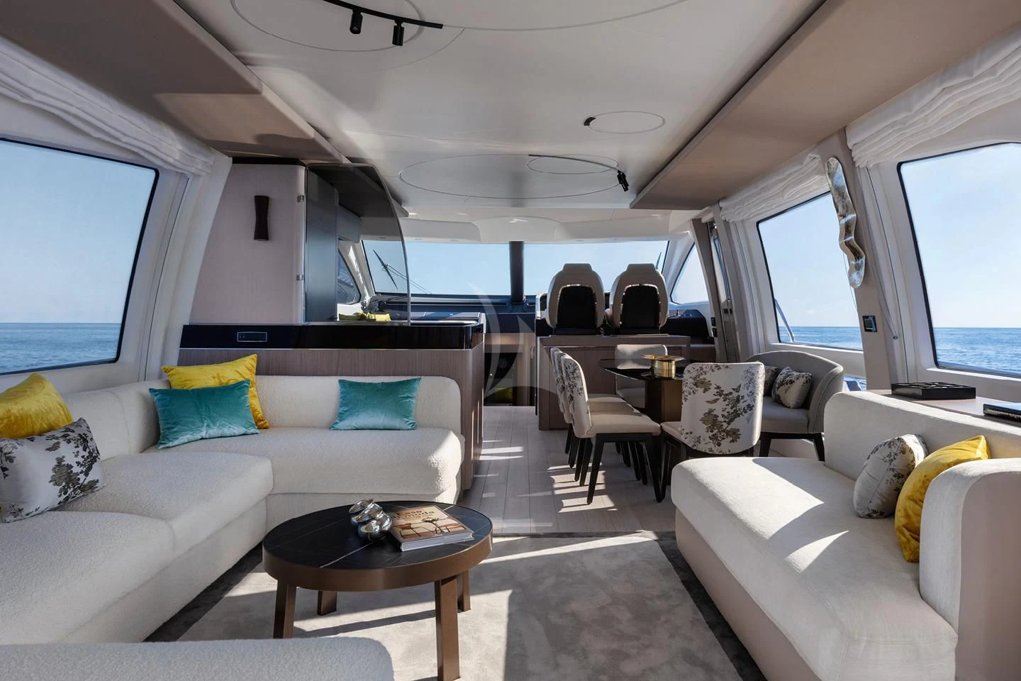 a living room with a couch and a table aboard SOLSTICE Yacht for Sale