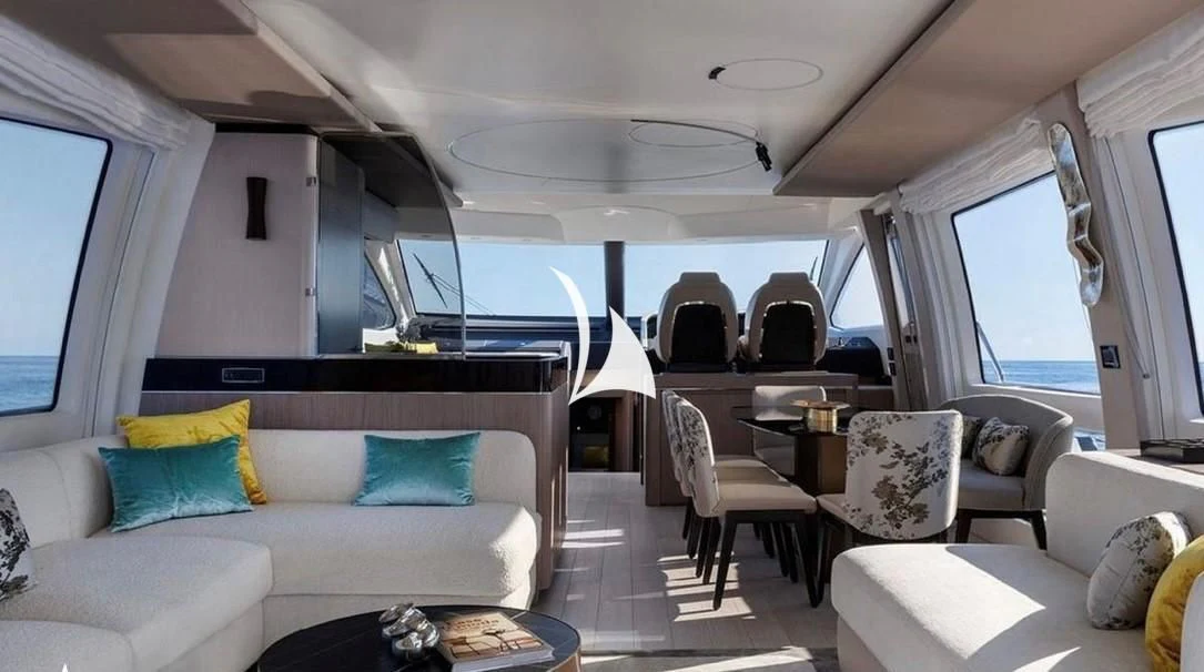 a living room with a couch and a table aboard SOLSTICE Yacht for Sale