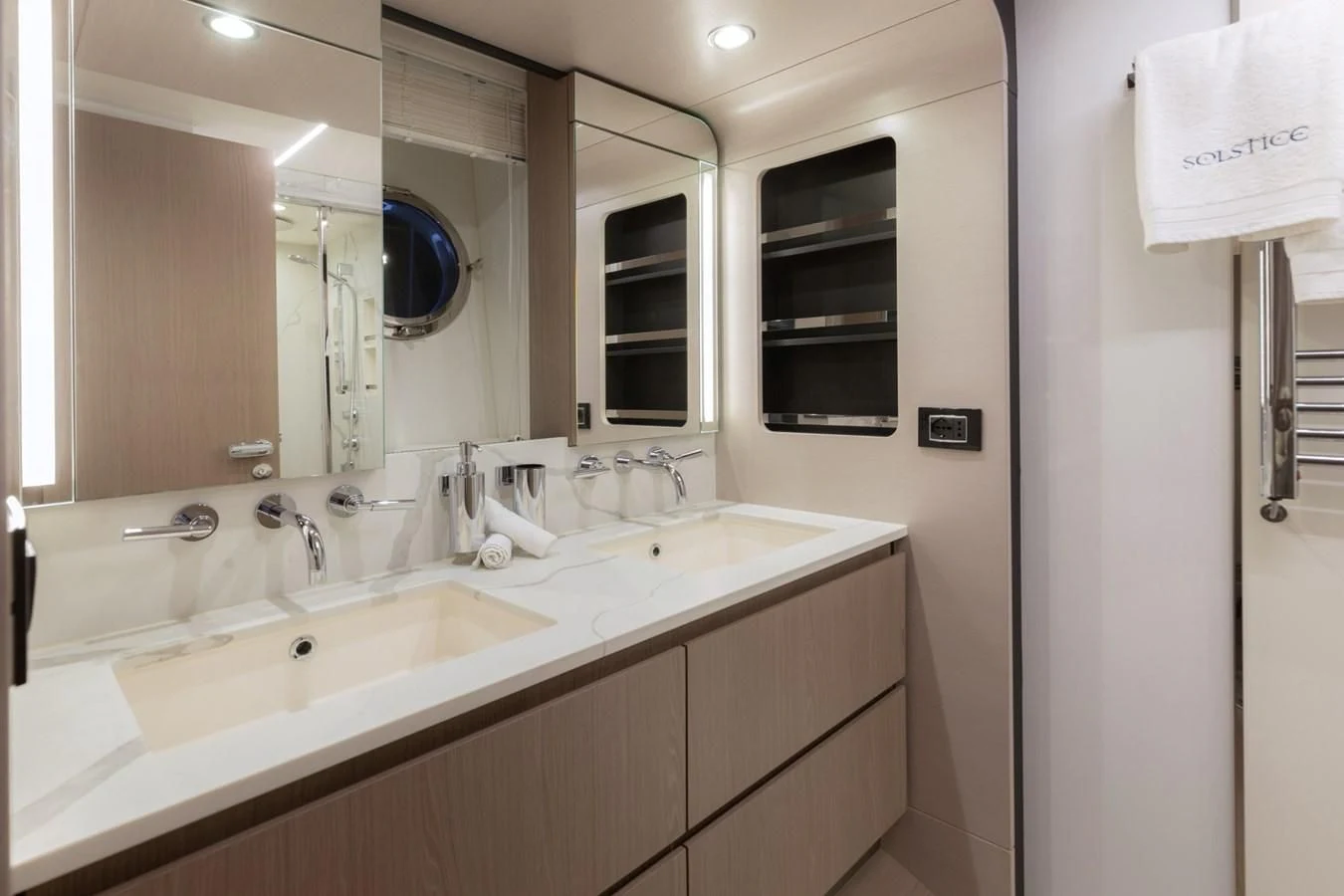 a bathroom with a sink and mirror aboard SOLSTICE Yacht for Sale