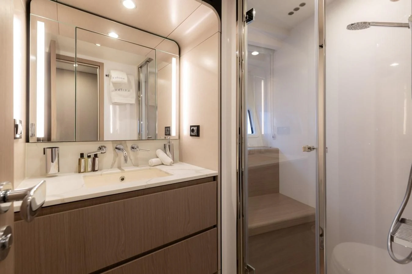 a bathroom with a large mirror aboard SOLSTICE Yacht for Sale