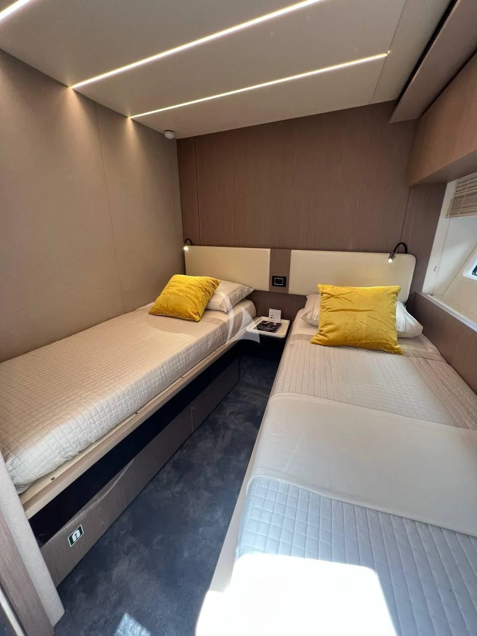 a couple of beds in a room aboard SOLSTICE Yacht for Sale