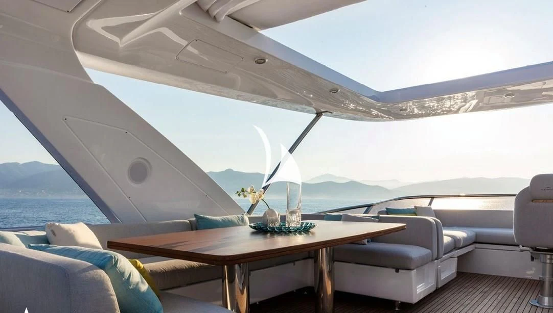 a glass table with a flower on it aboard SOLSTICE Yacht for Sale