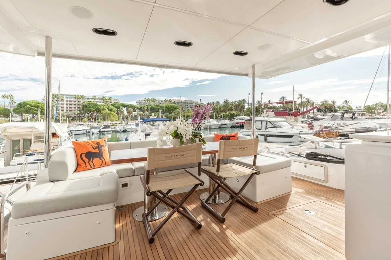 a room with a table chairs and a window with a view of the city aboard SOLSTICE Yacht for Sale