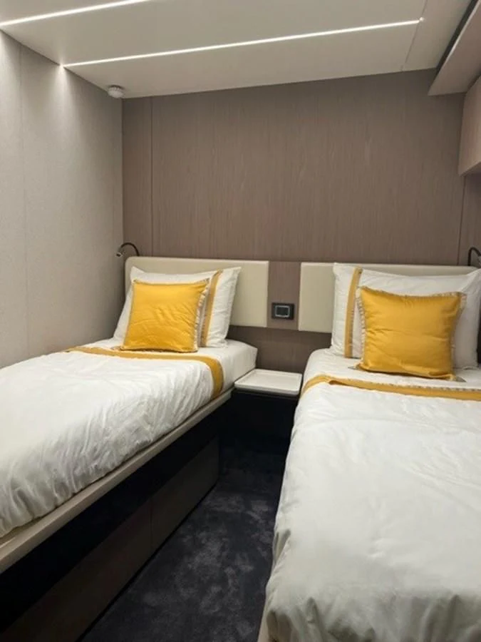 a couple of beds in a hotel room aboard SOLSTICE Yacht for Sale