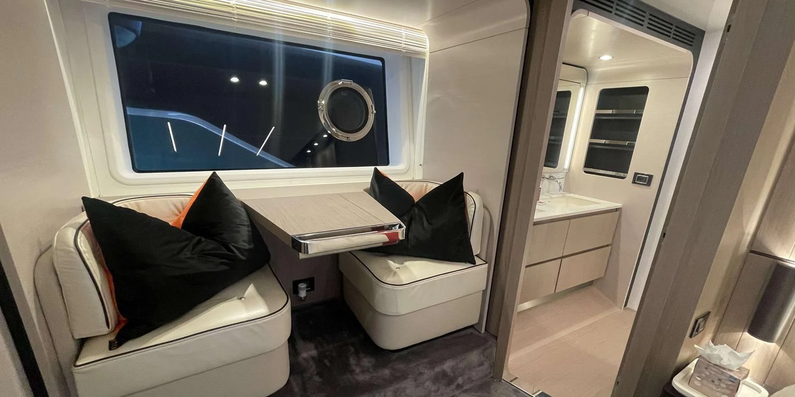 a room with a bed and a chair aboard SOLSTICE Yacht for Sale