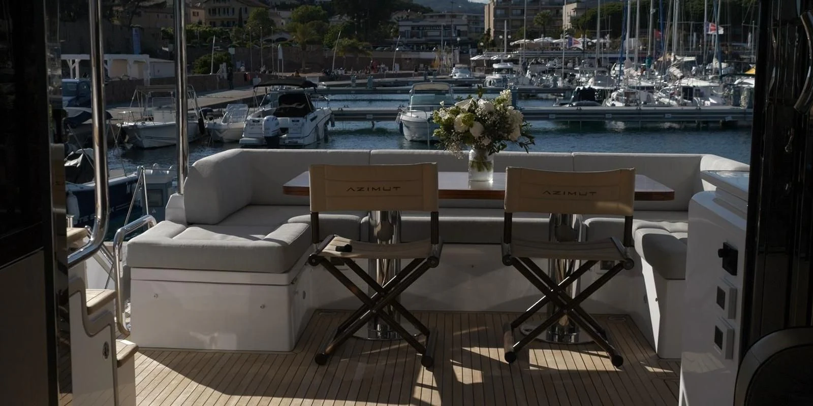 a table and chairs on a balcony aboard SOLSTICE Yacht for Sale
