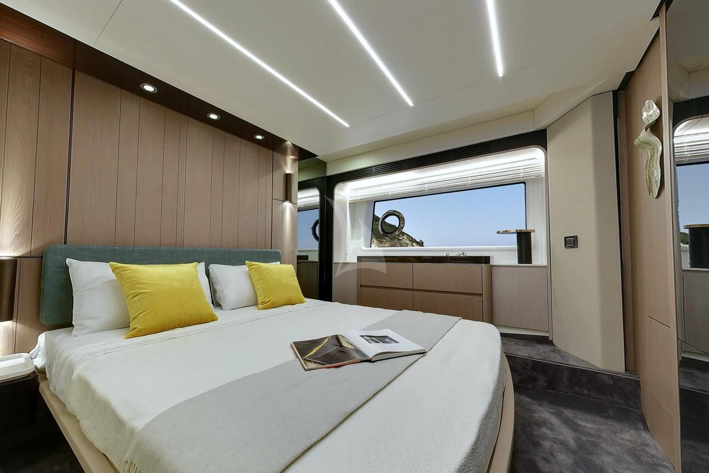 a bed with yellow pillows aboard SOLSTICE Yacht for Sale