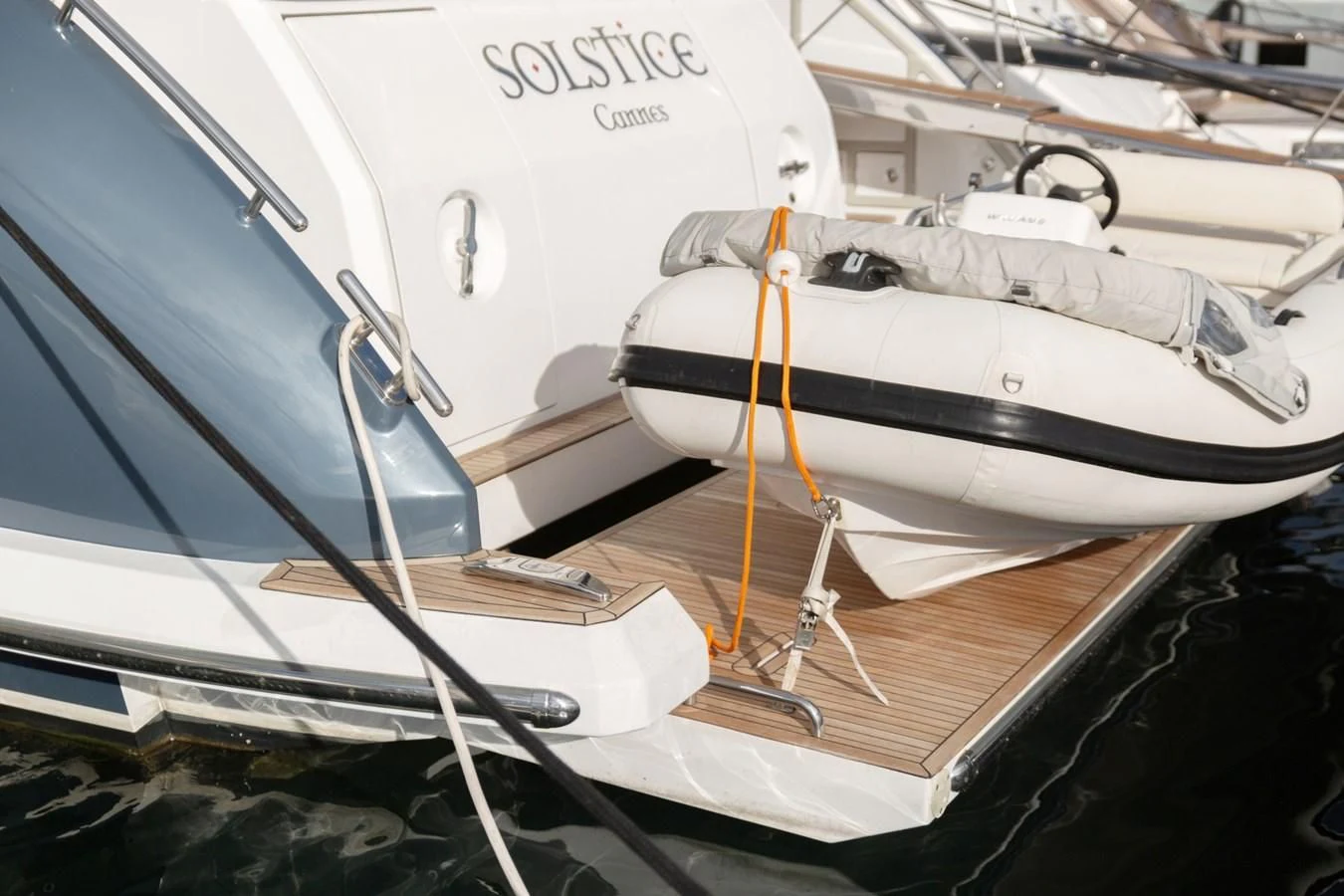 a couple of boats sit on a dock aboard SOLSTICE Yacht for Sale
