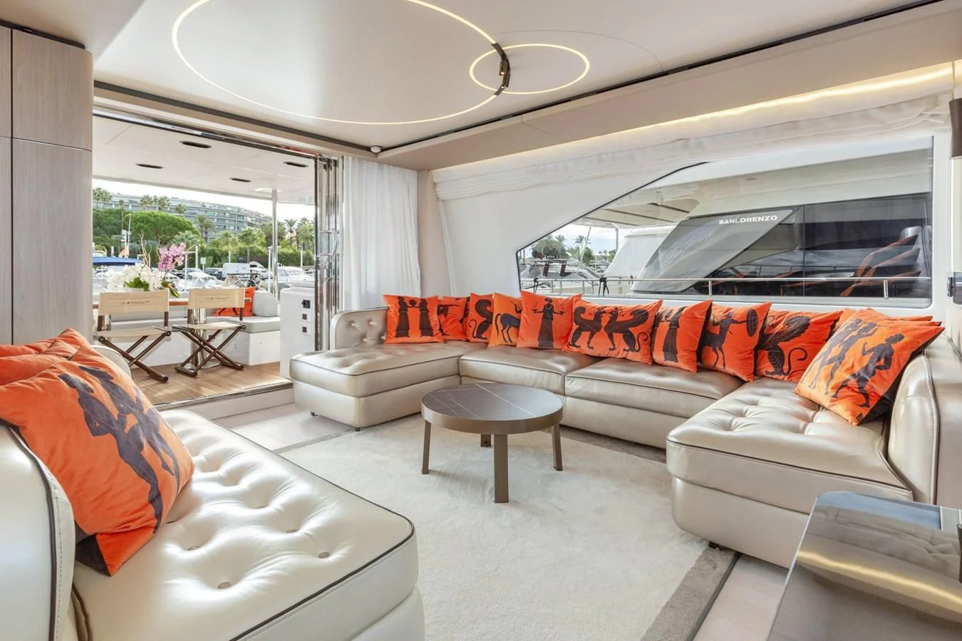 a living room with a couch and a table aboard SOLSTICE Yacht for Sale