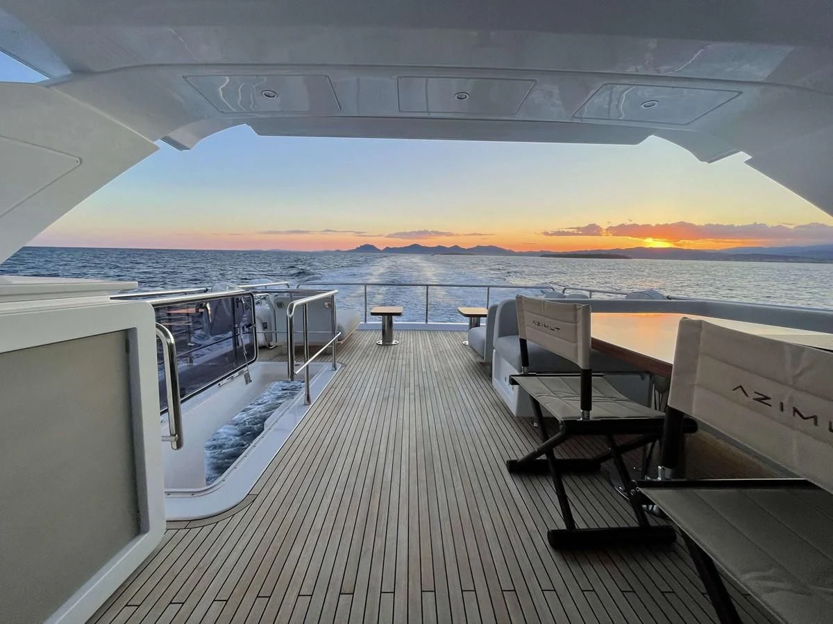 a deck overlooking a sunset aboard SOLSTICE Yacht for Sale