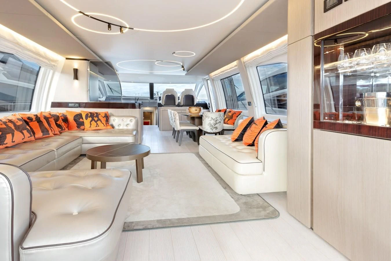 a living room with a couch and a table aboard SOLSTICE Yacht for Sale
