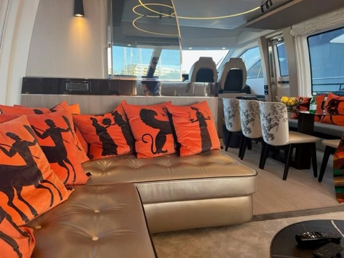 a living room with a couch and chairs aboard SOLSTICE Yacht for Sale