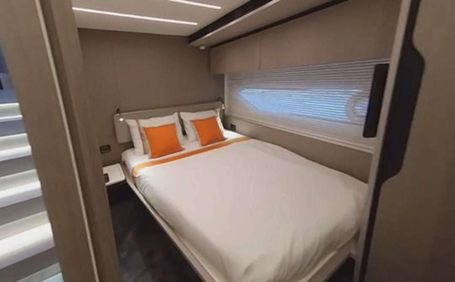 a bed in a room aboard SOLSTICE Yacht for Sale