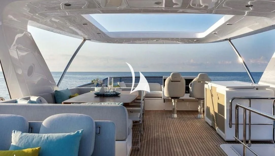 a boat with a table and chairs aboard SOLSTICE Yacht for Sale