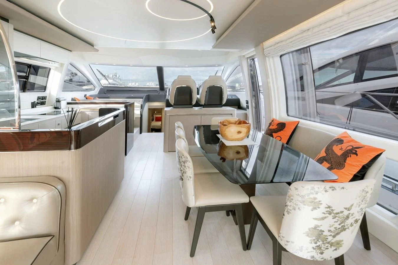 inside of a vehicle with a table and chairs aboard SOLSTICE Yacht for Sale
