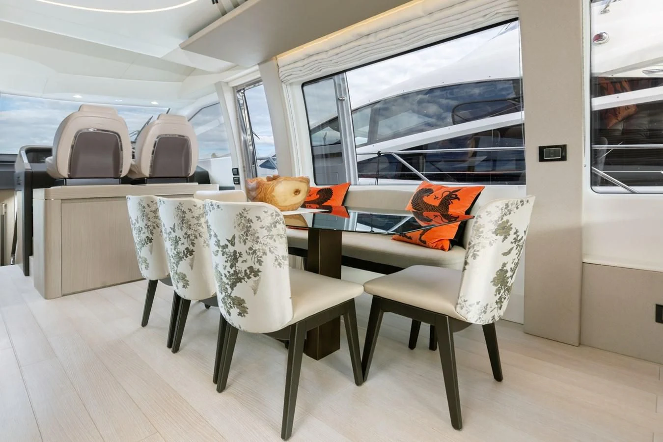 a room with chairs and a table aboard SOLSTICE Yacht for Sale