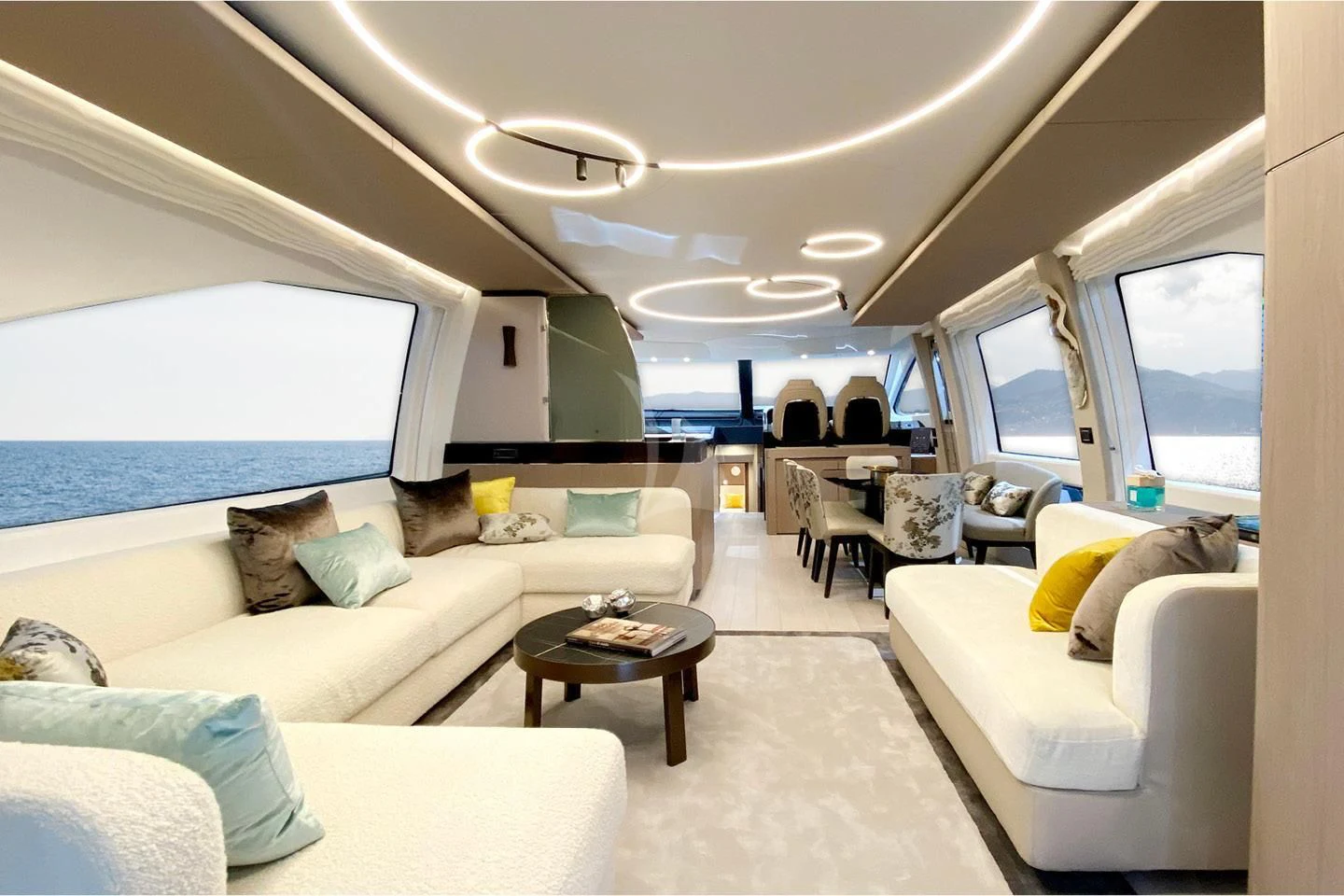 a living room with a large window aboard SOLSTICE Yacht for Sale
