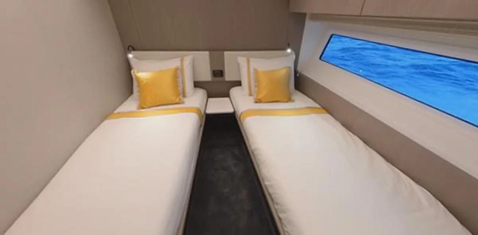 a room with beds and a window aboard SOLSTICE Yacht for Sale
