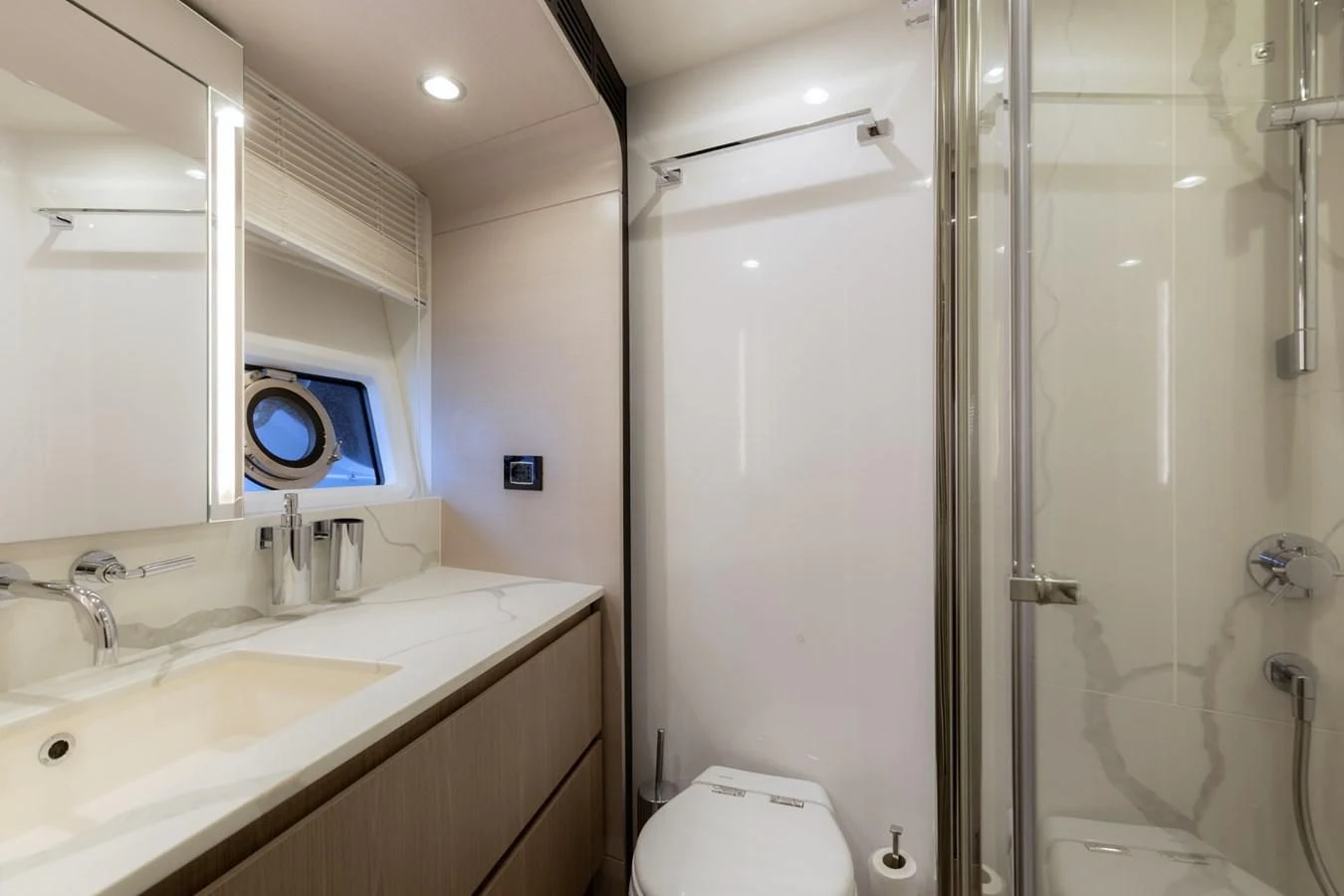 a bathroom with a shower and sink aboard SOLSTICE Yacht for Sale