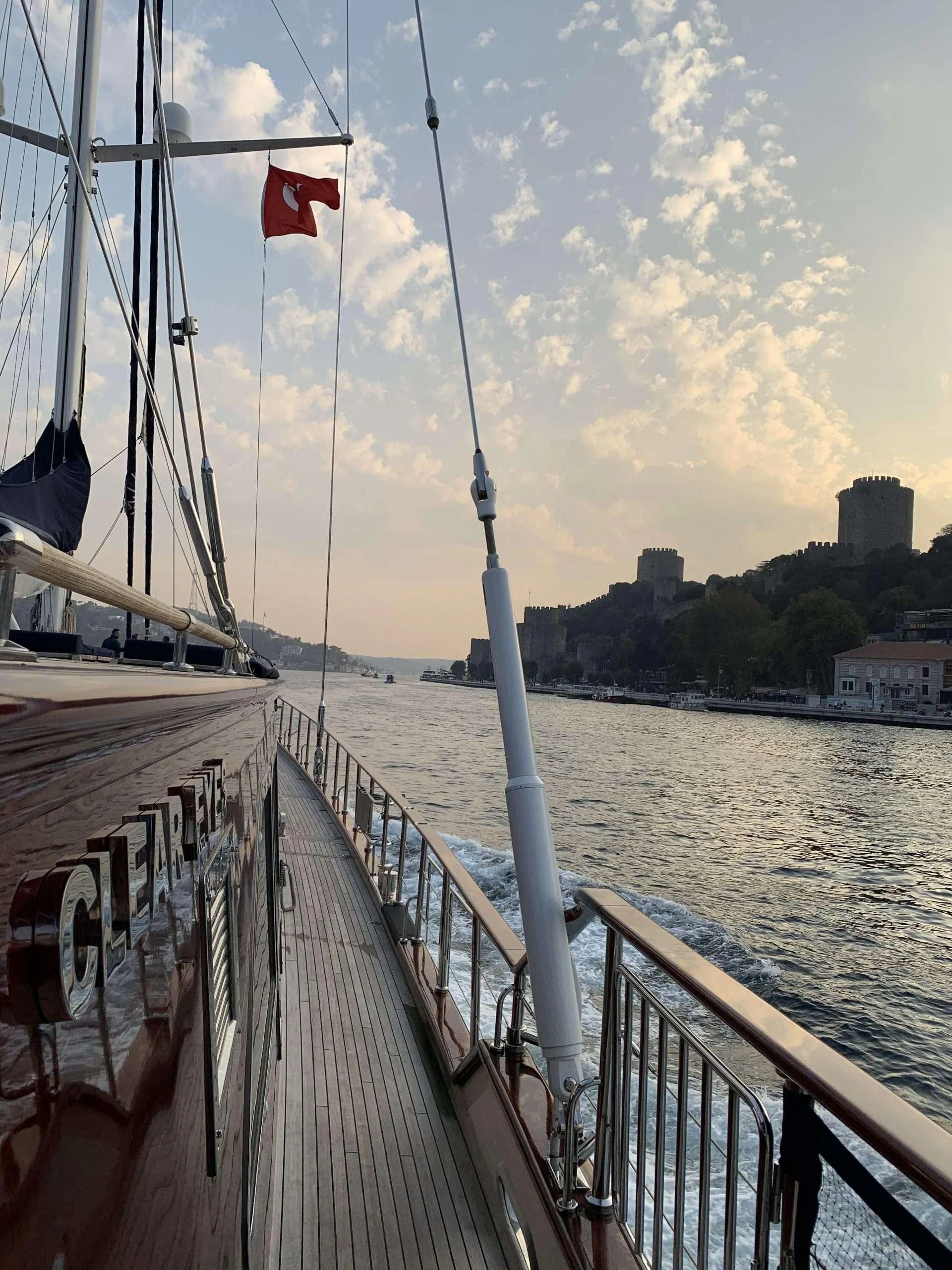 a boat with a flag on it aboard CLEAR EYES Yacht for Sale