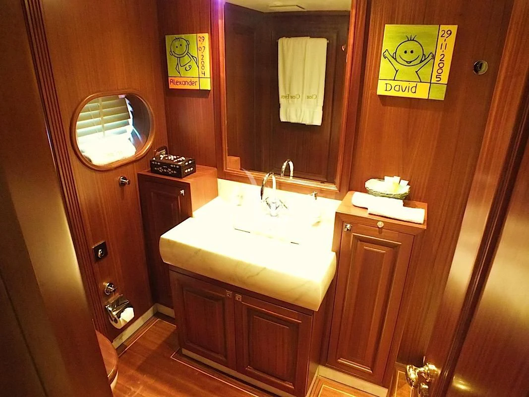 a bathroom with a sink and a mirror aboard CLEAR EYES Yacht for Sale