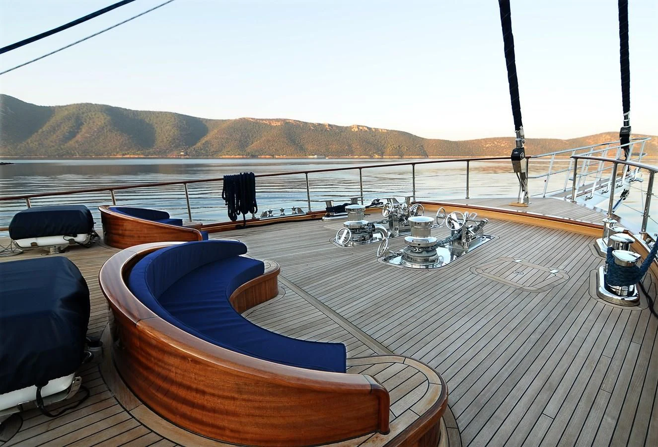 a deck with a large blue pool and a large body of water aboard CLEAR EYES Yacht for Sale