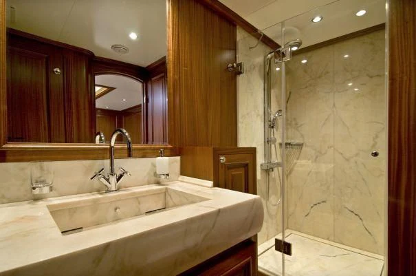 a bathroom with a glass shower aboard CLEAR EYES Yacht for Sale