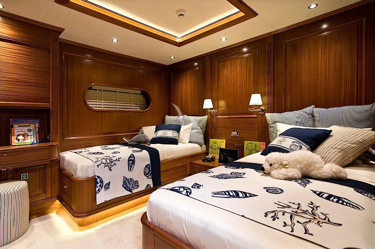 a bedroom with a couple beds aboard CLEAR EYES Yacht for Sale