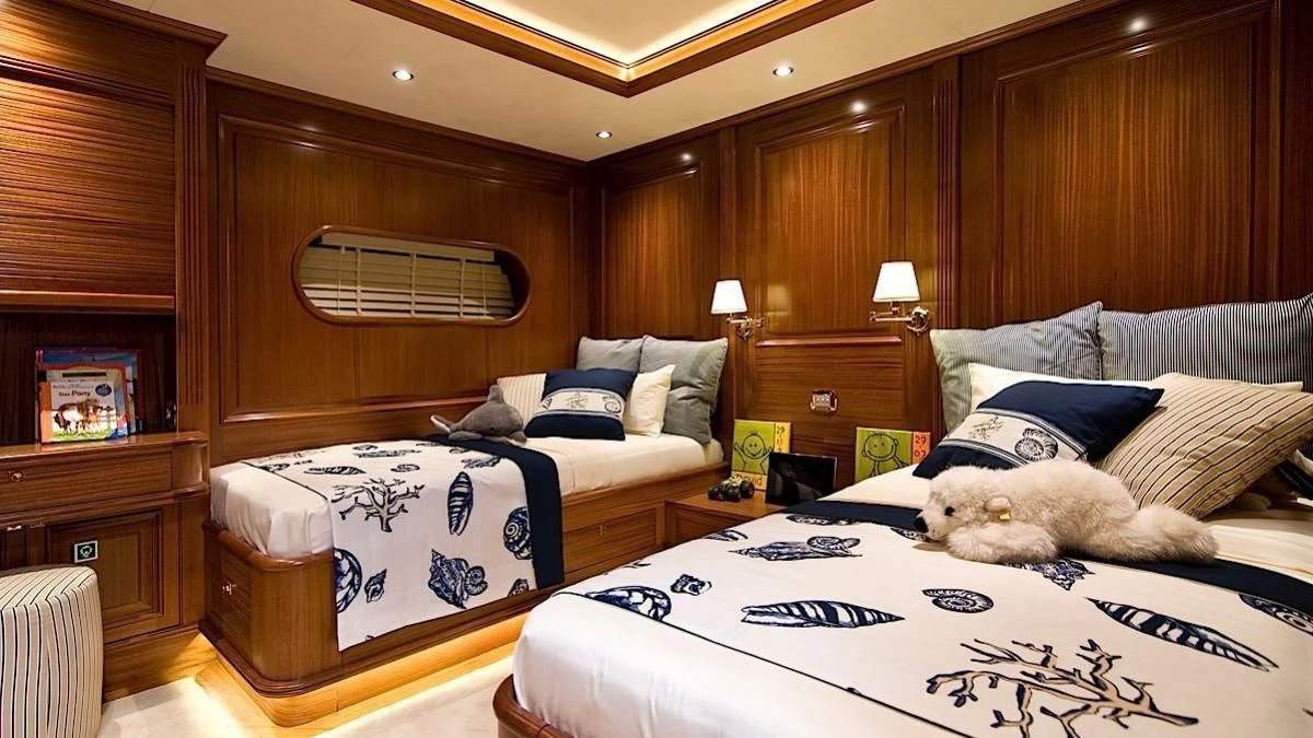 a bedroom with a couple beds aboard CLEAR EYES Yacht for Sale