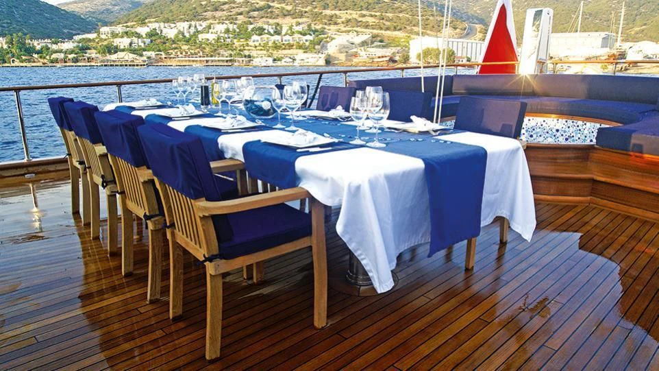 a table set for a dinner party aboard CLEAR EYES Yacht for Sale