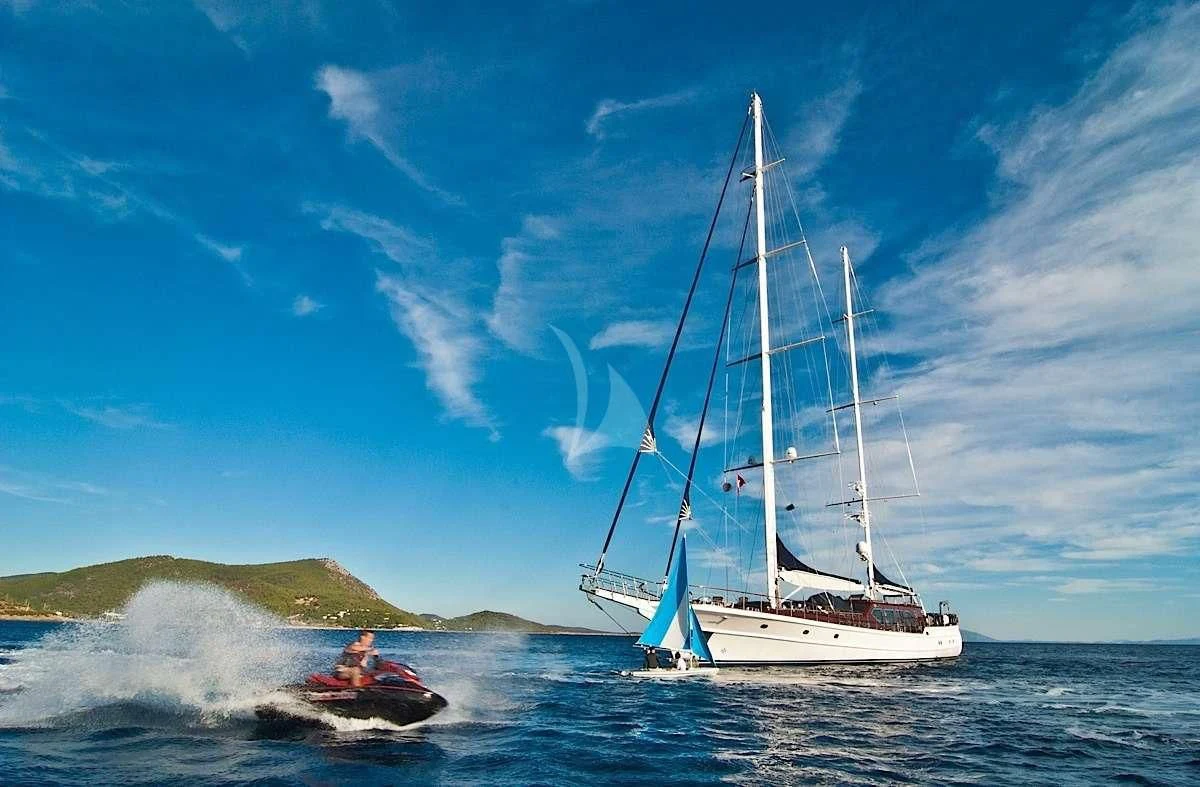 a couple of people in a sailboat on the water aboard CLEAR EYES Yacht for Sale