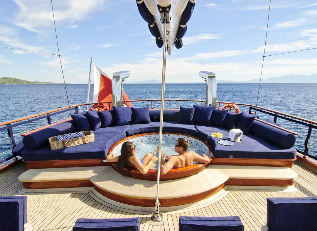 a couple of people sitting in a boat on the water aboard CLEAR EYES Yacht for Sale
