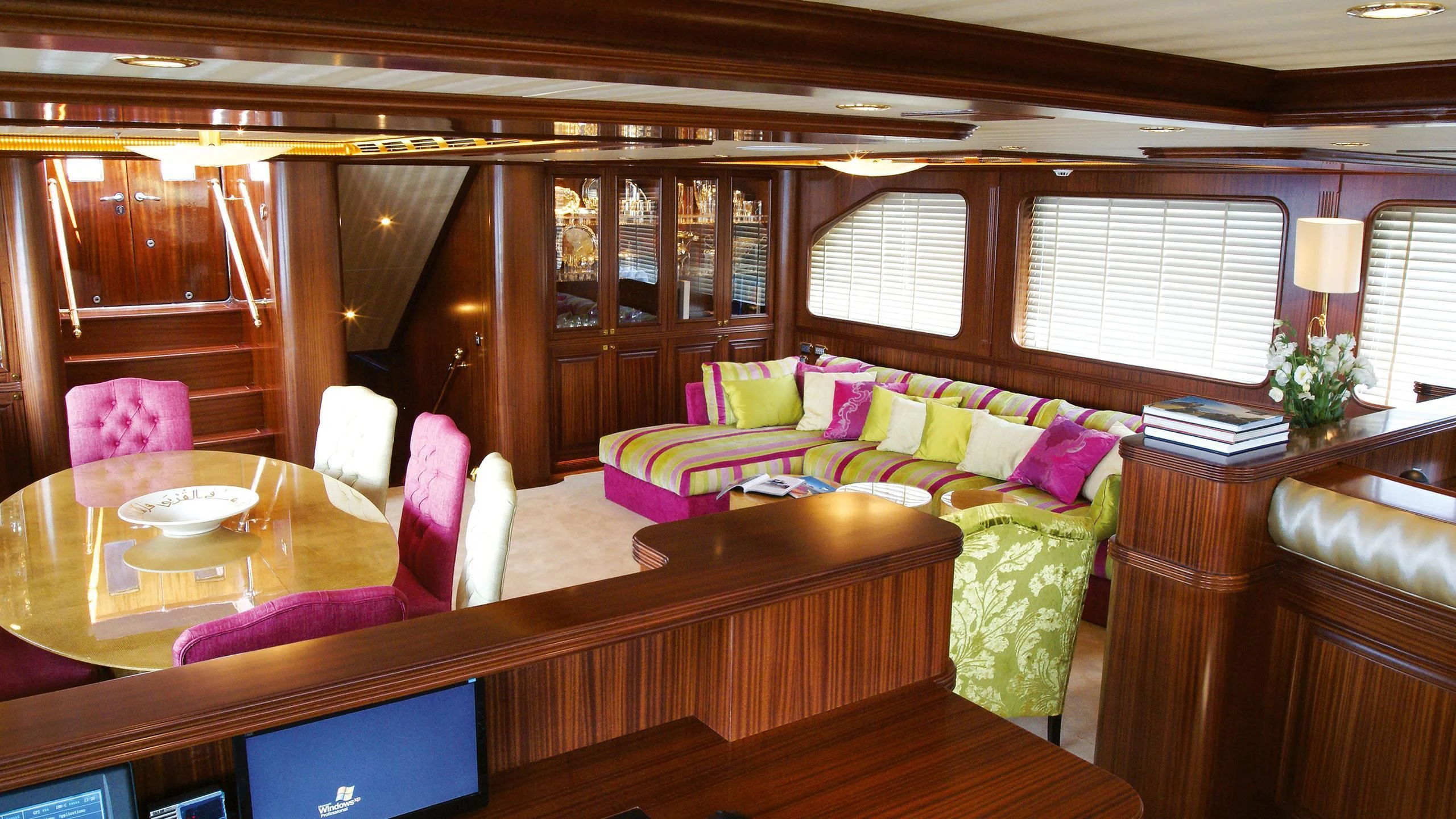 a room with a couch and a table and chairs aboard CLEAR EYES Yacht for Sale