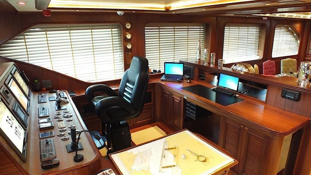 a room with a desk and computer aboard CLEAR EYES Yacht for Sale